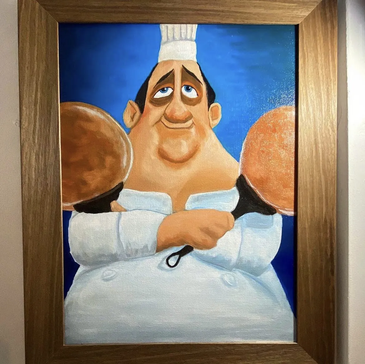 A cartoon chef with arms crossed