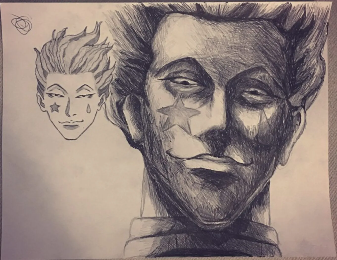 Hisoka with a small sketch beside him