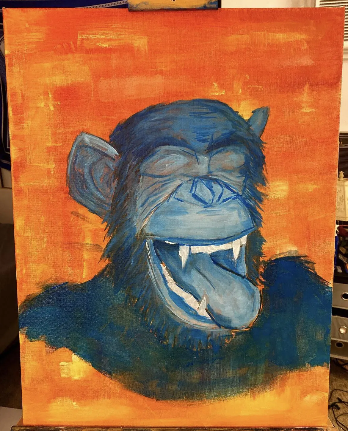 A blue ape laughing on an orange ground