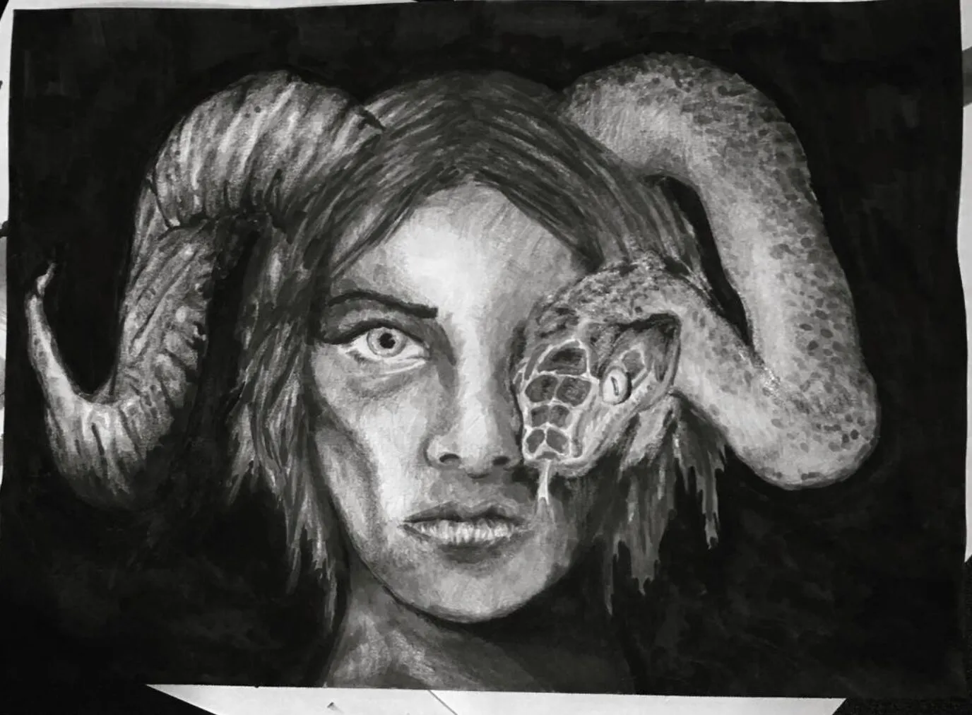 A girl with ram horns and a snake