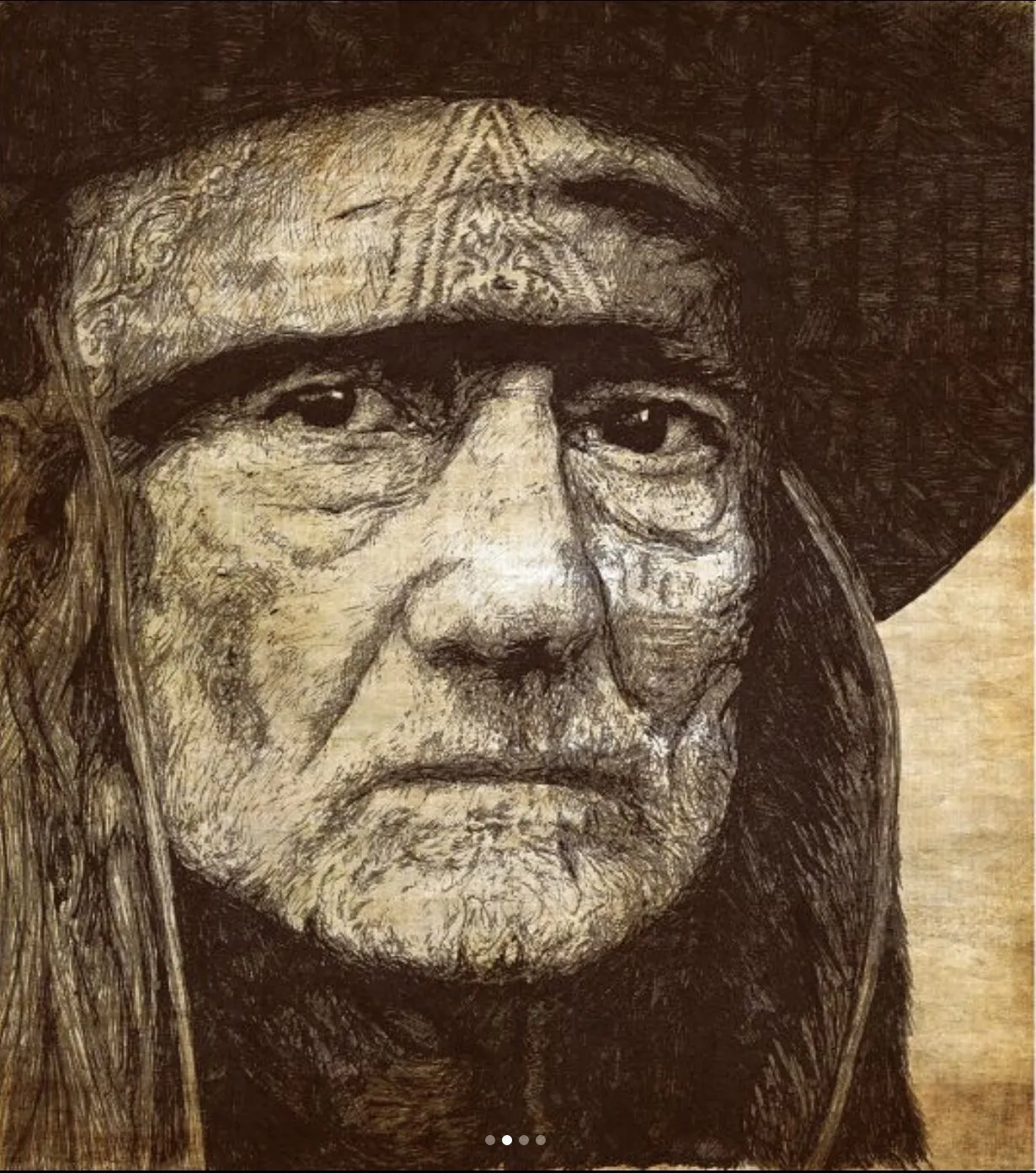 A long-haired man in a hat